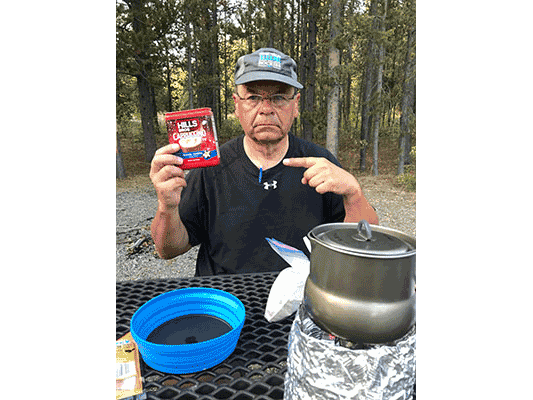 Larry with bag of coffee grounds